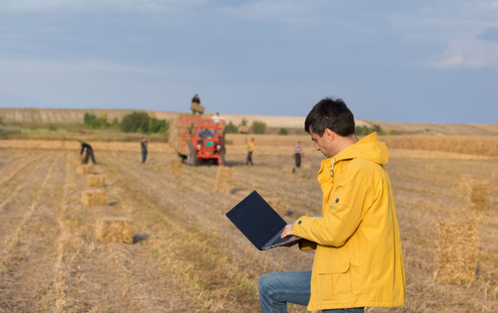 Farmer in field during baling